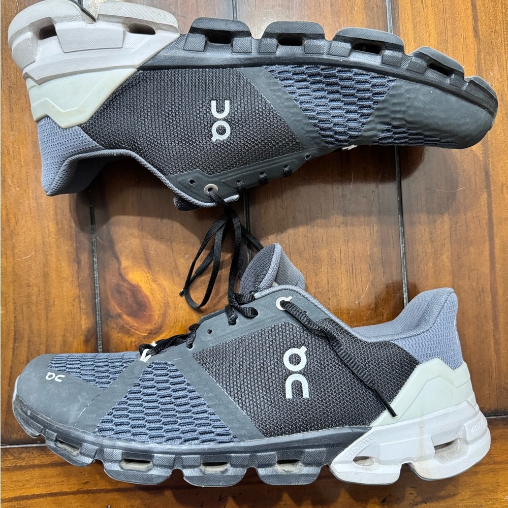 On Running Black and White Athletic Shoes with CloudTec Technology